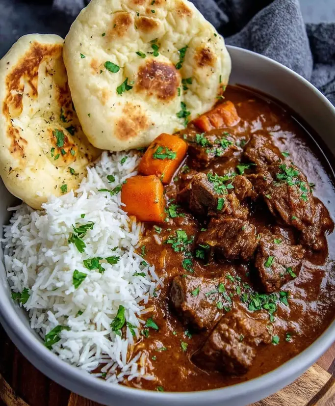 Slow braised spiced beef curry with garlic naan
