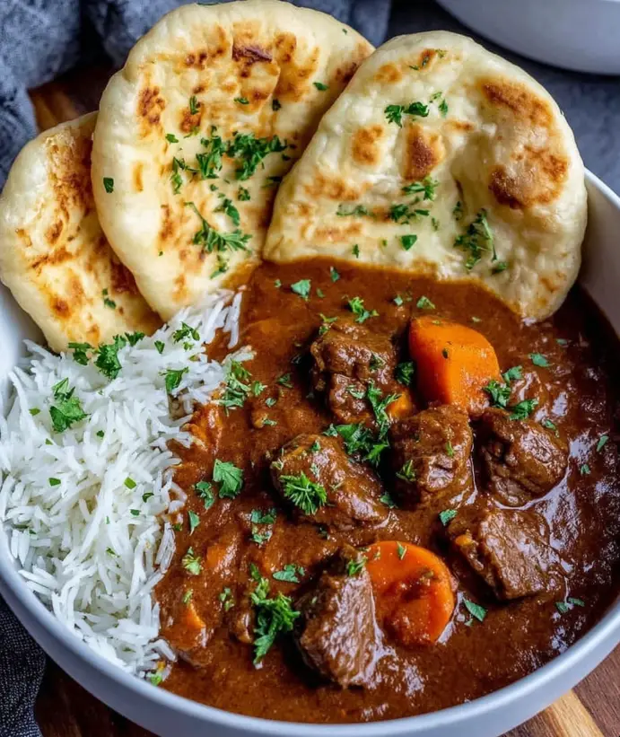 Slow braised spiced beef curry with garlic naan